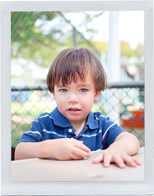 Photograph: A male toddler sits at a table. (Photograph by Alex Lazara)